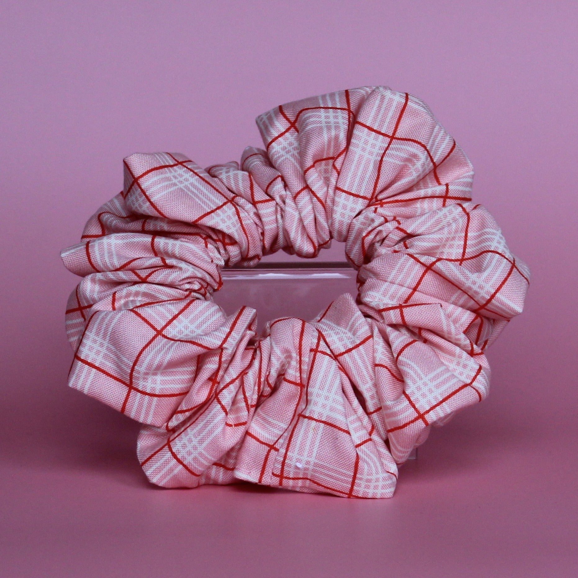 Pink oversized hair scrunchie with red and white check pattern