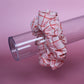 Pink oversized hair scrunchie with red and white check pattern