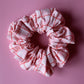 Pink oversized hair scrunchie with red and white check pattern