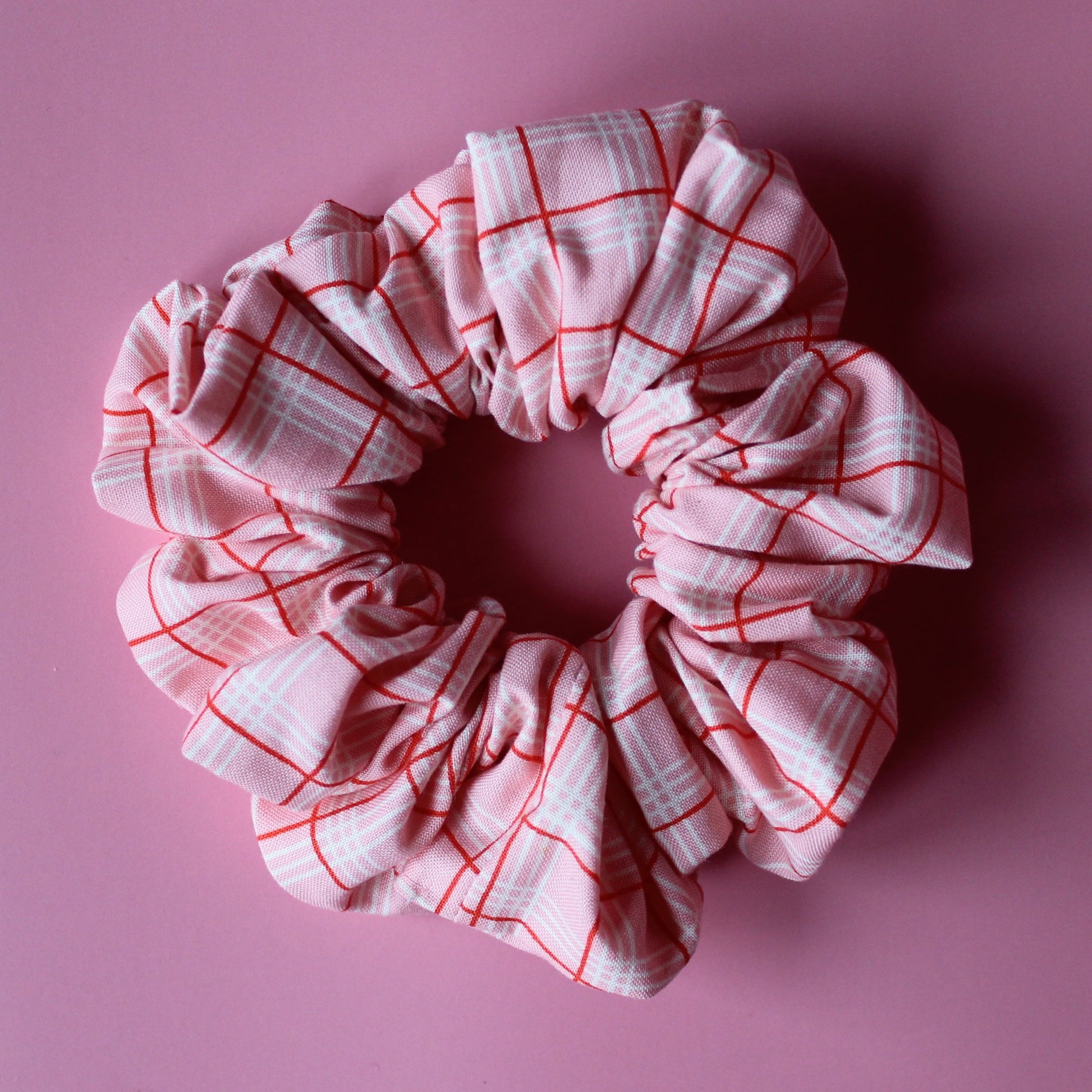 Pink oversized hair scrunchie with red and white check pattern
