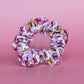 White scrunchie with bold pink and orange butterflies