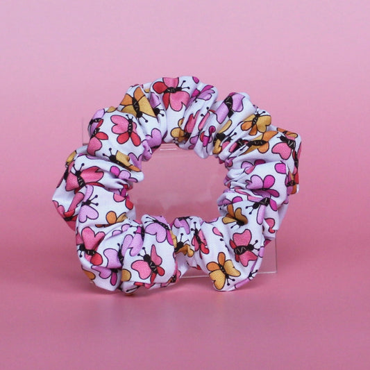 White scrunchie with bold pink and orange butterflies