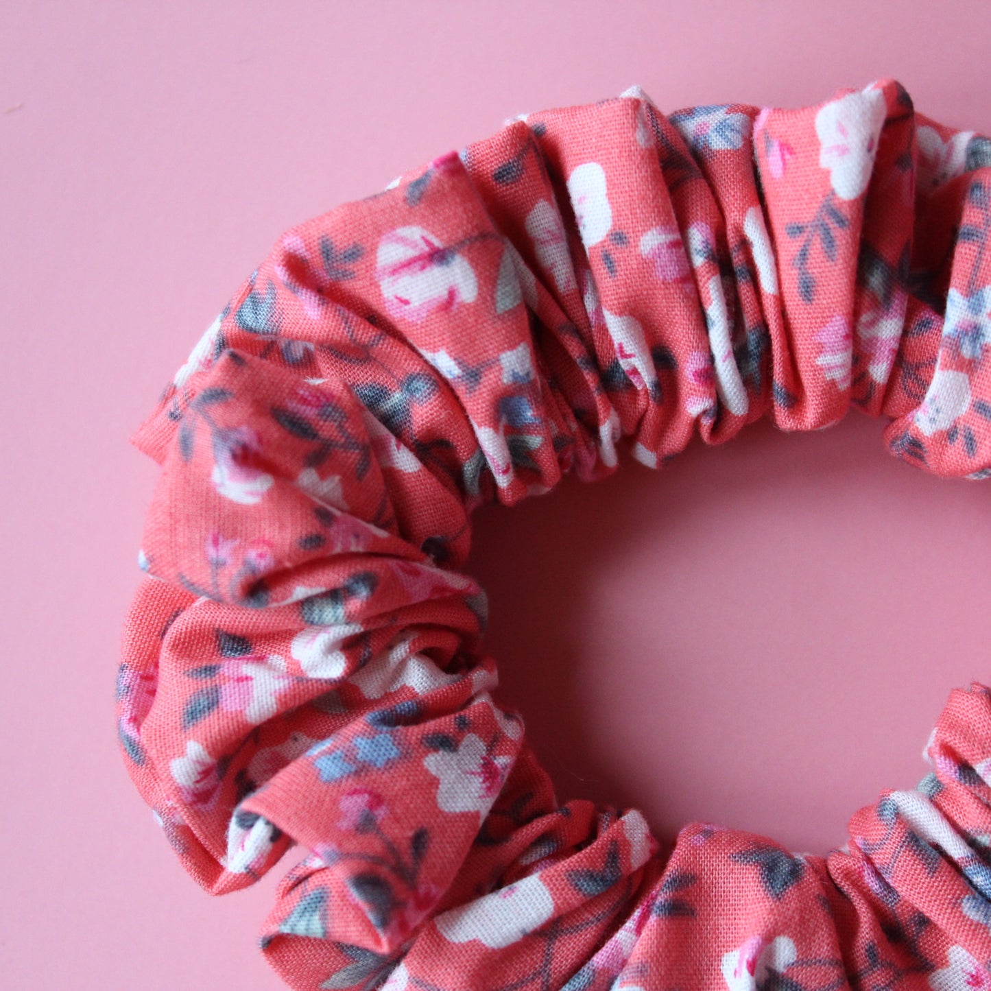Reddish-pink floral hair scrunchie