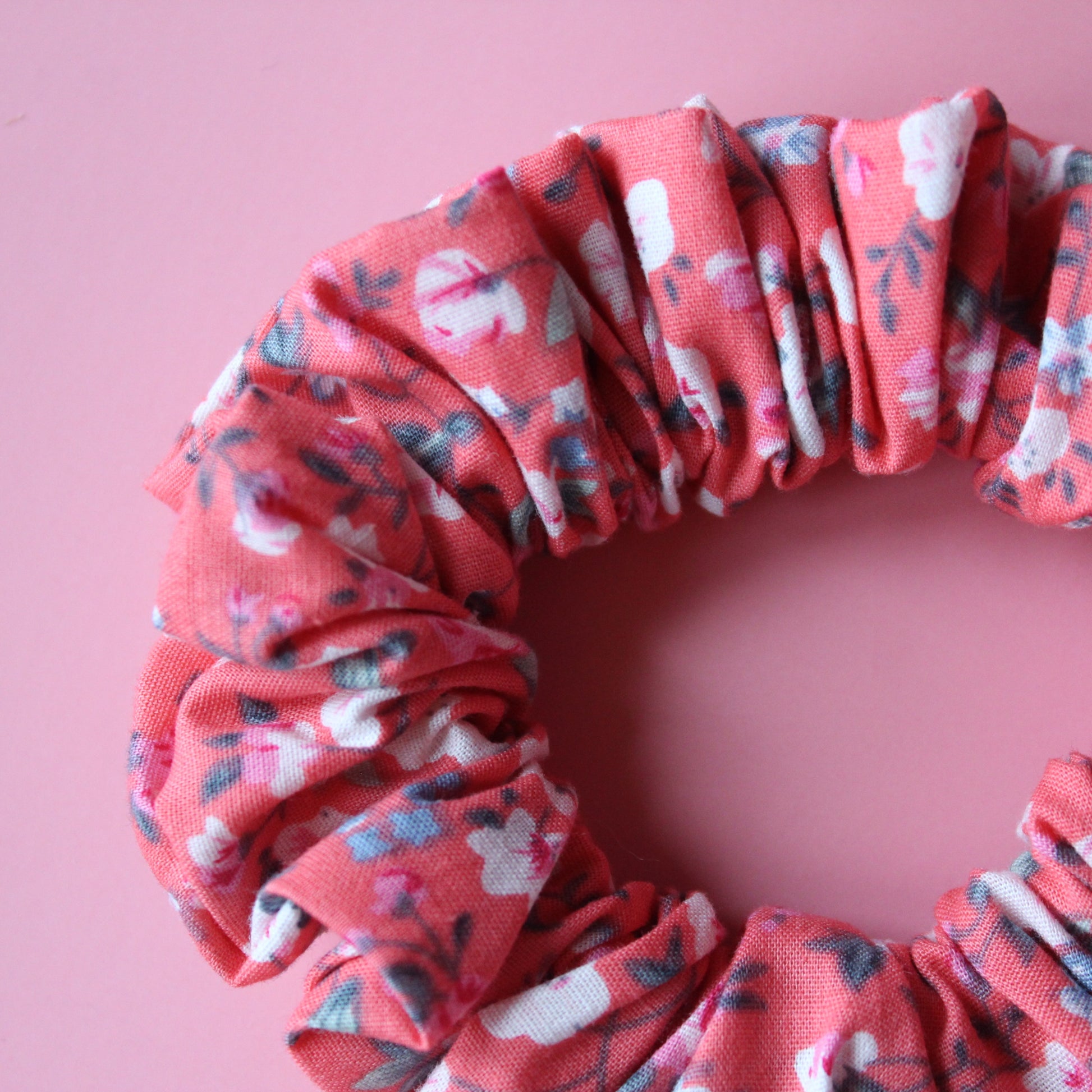 Reddish-pink floral hair scrunchie