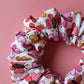 White scrunchie with bold pink and orange butterflies