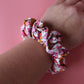 White scrunchie with bold pink and orange butterflies