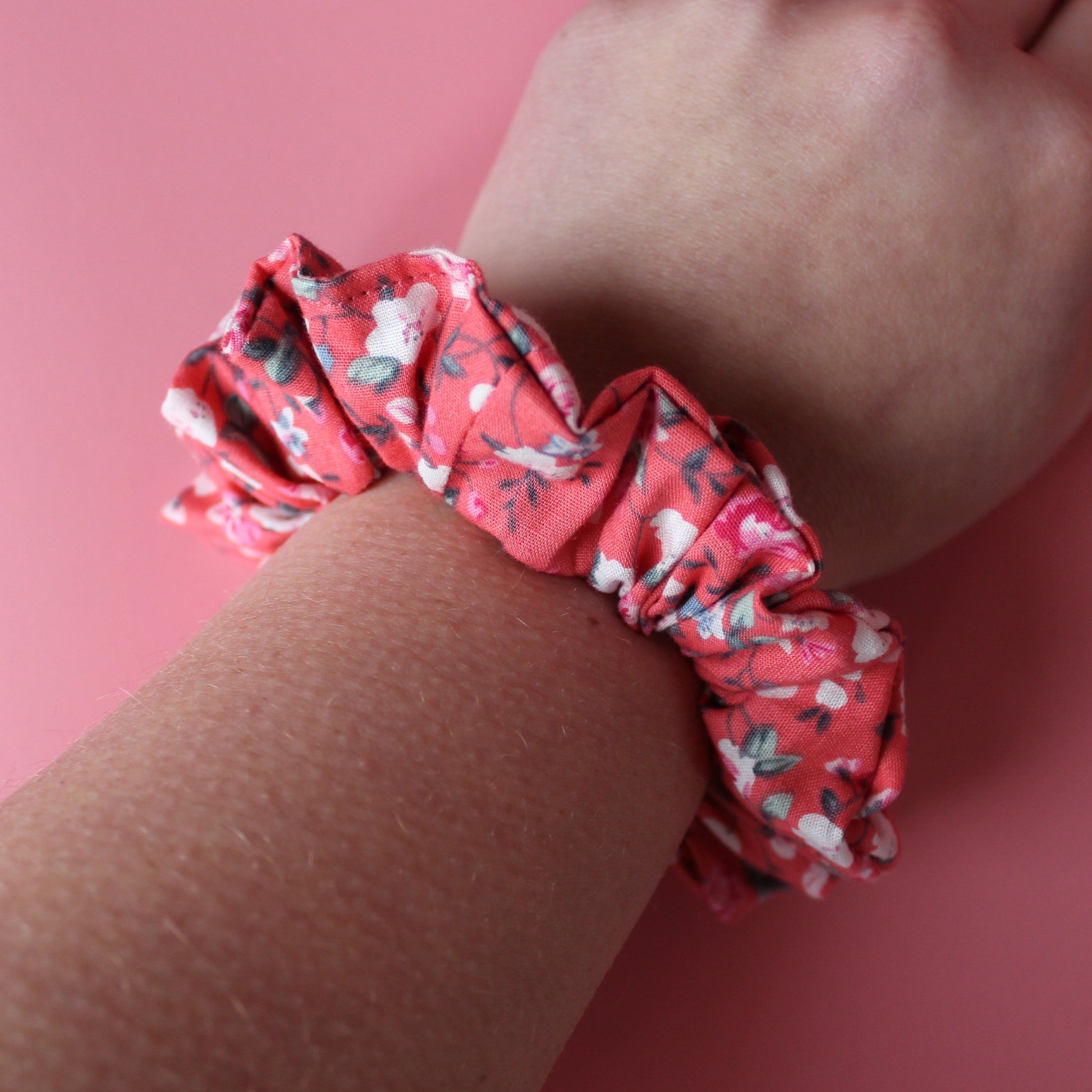 Reddish-pink floral hair scrunchie