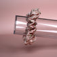 Pale pink scrunchie with subtle red small flowers
