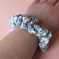 Blue and purple floral hair scrunchie
on wrist
