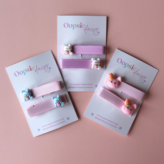 Pink hair clips with bunny rabbit embellishments