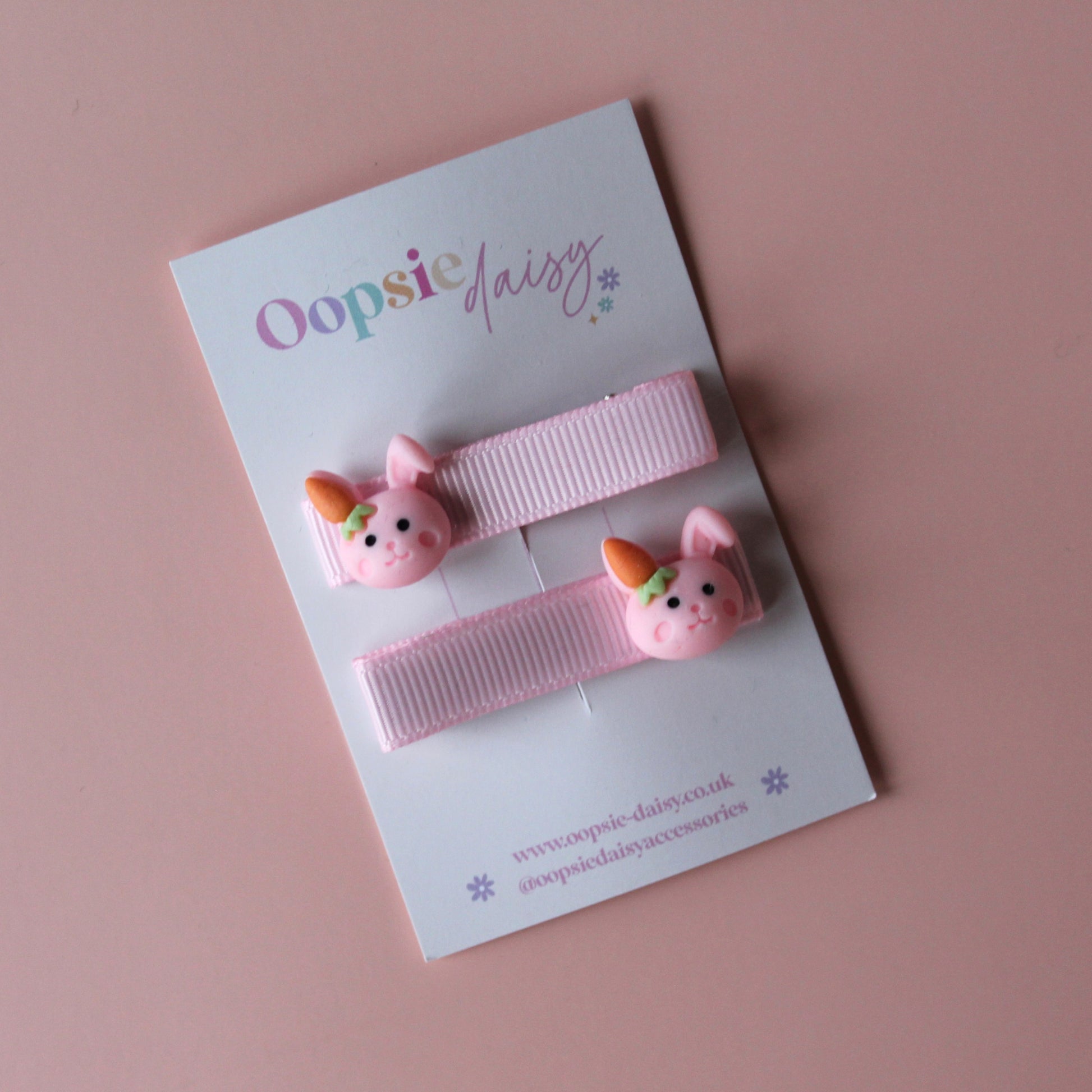 Pink hair clips with bunny rabbit embellishments