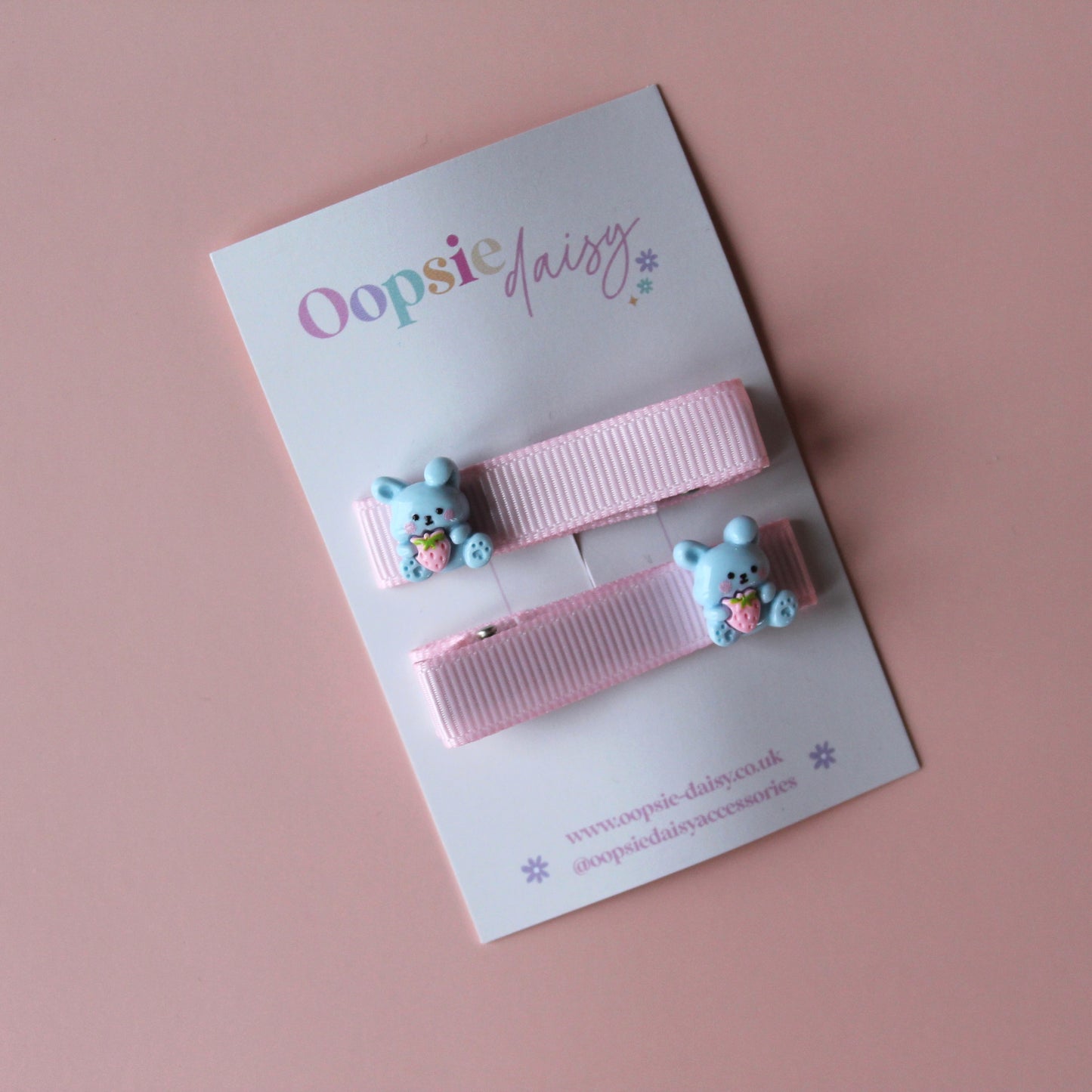 Pink hair clips with bunny rabbit embellishments