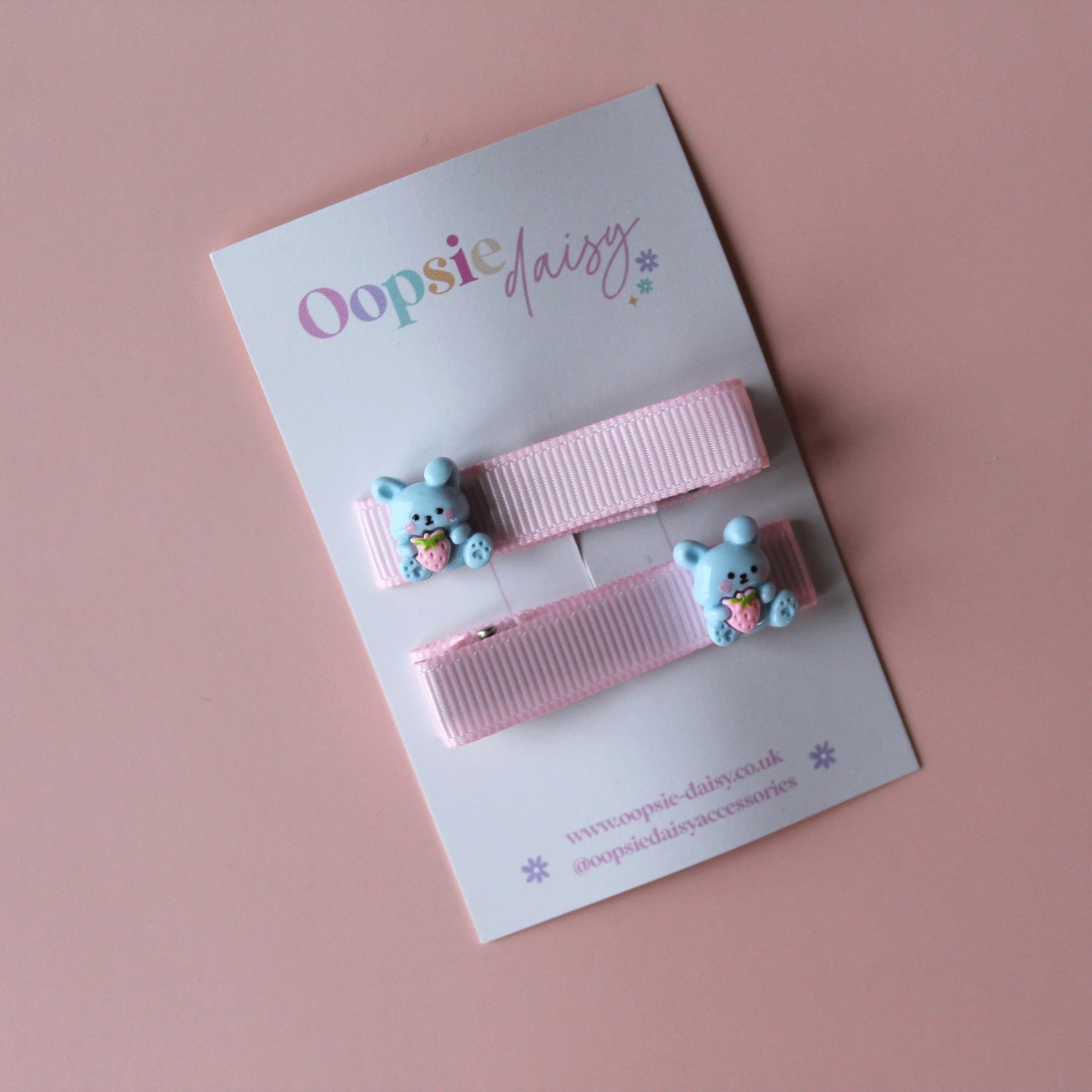 Pink hair clips with bunny rabbit embellishments