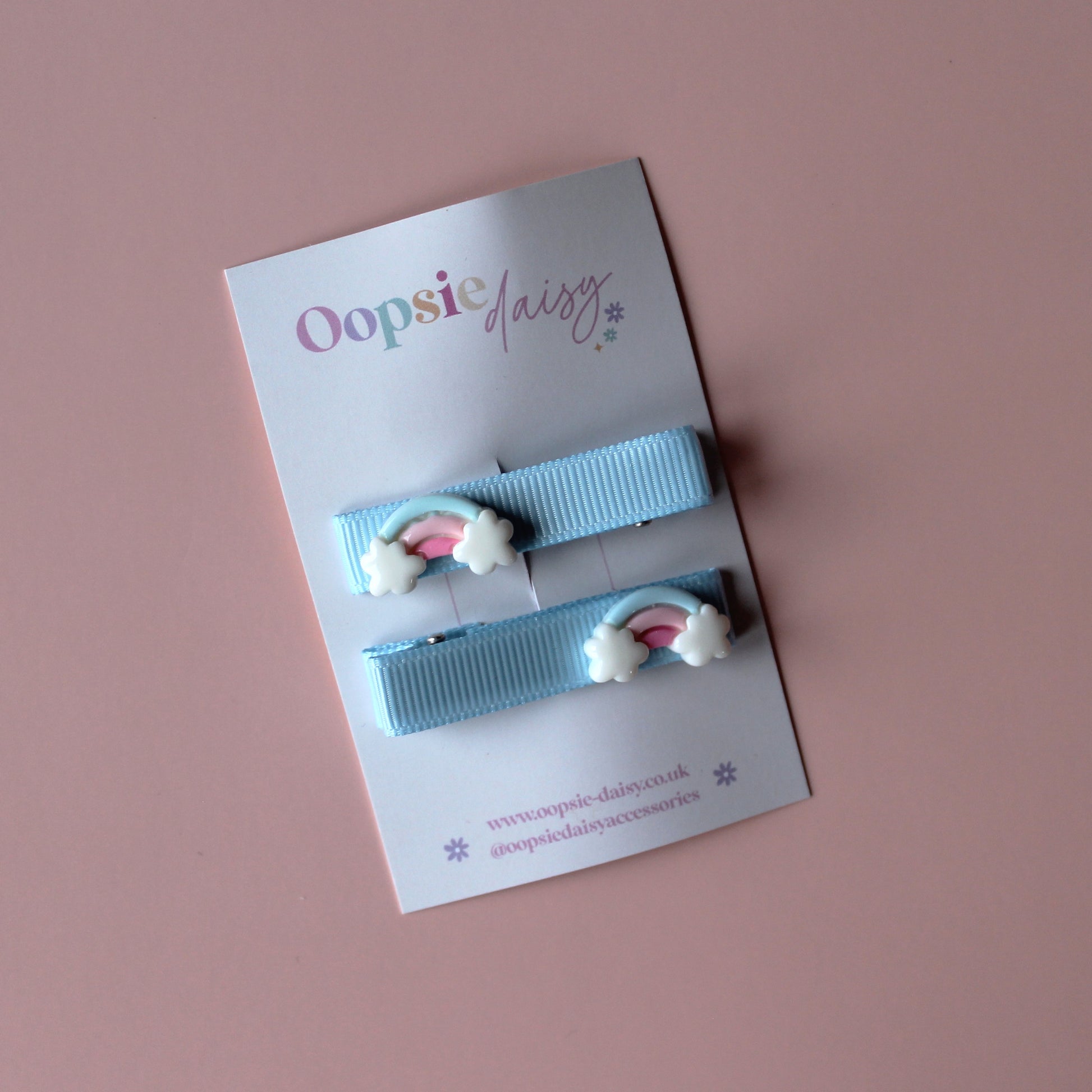 Blue hair slider clips with rainbow embellishments