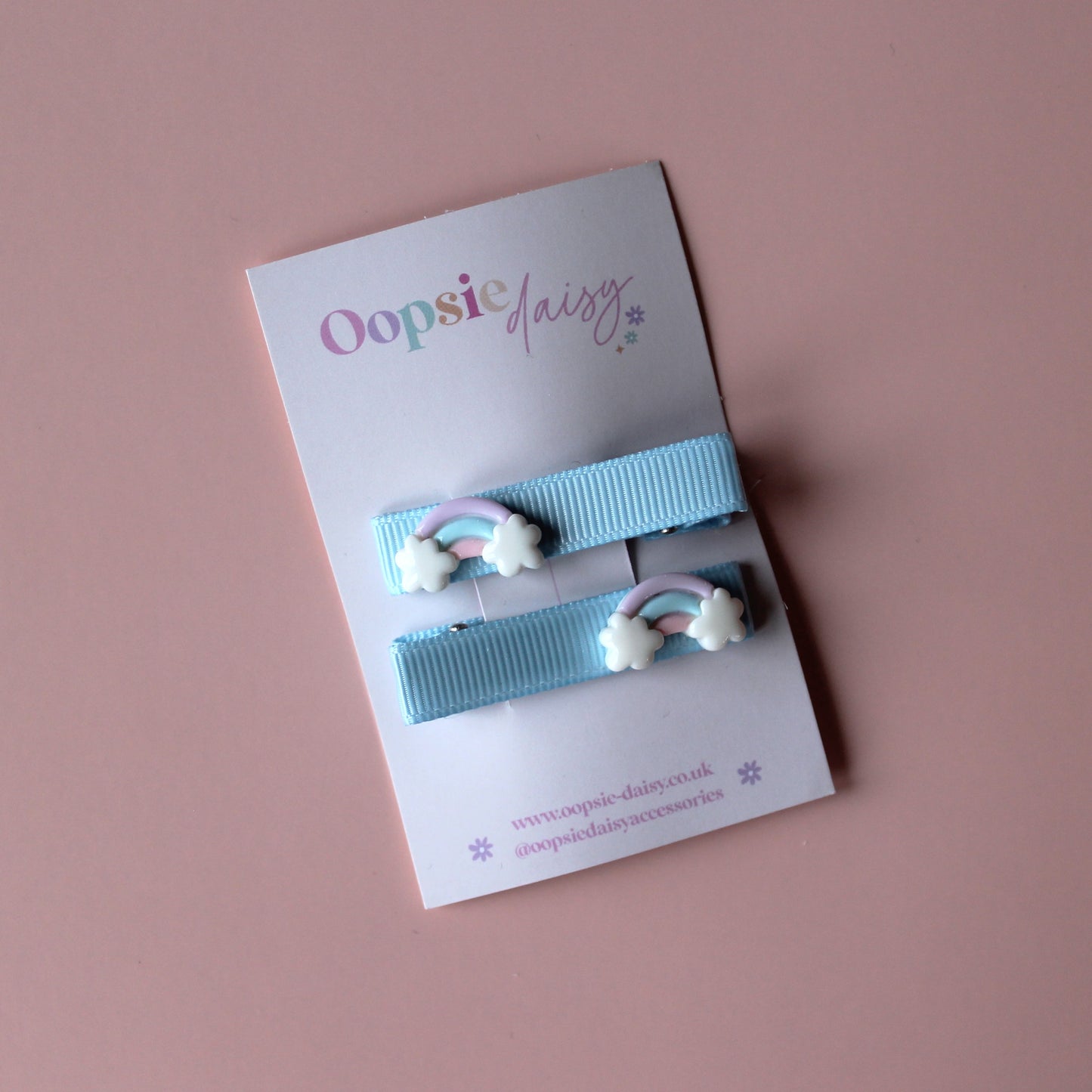 Blue hair slider clips with rainbow embellishments