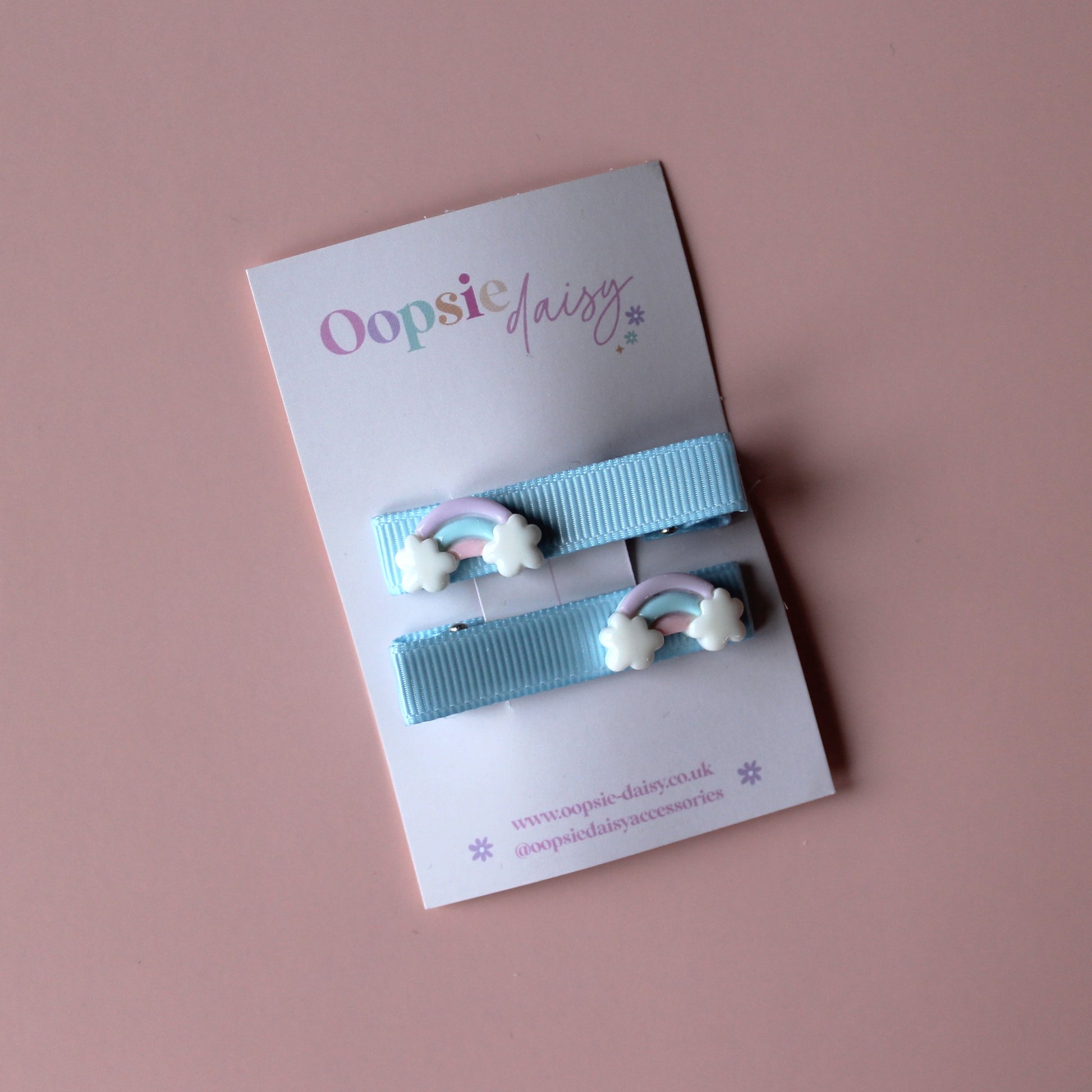 Blue hair slider clips with rainbow embellishments
