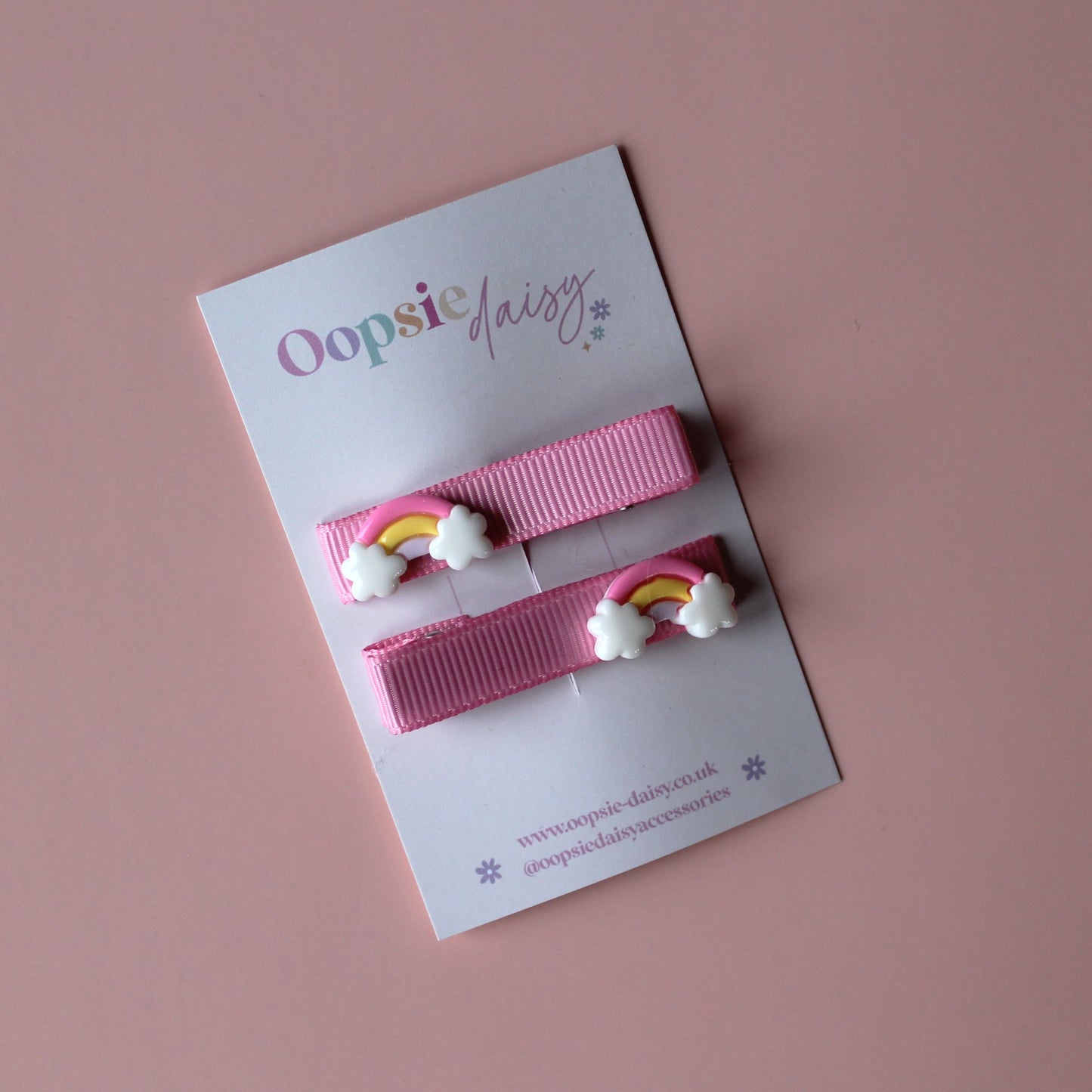 Pink hair slider clips with rainbow embellishments