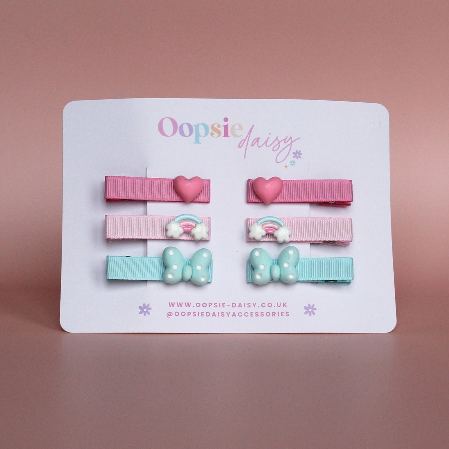 Set of colourful hair sliders with heart, rainbow and butterfly embellishments