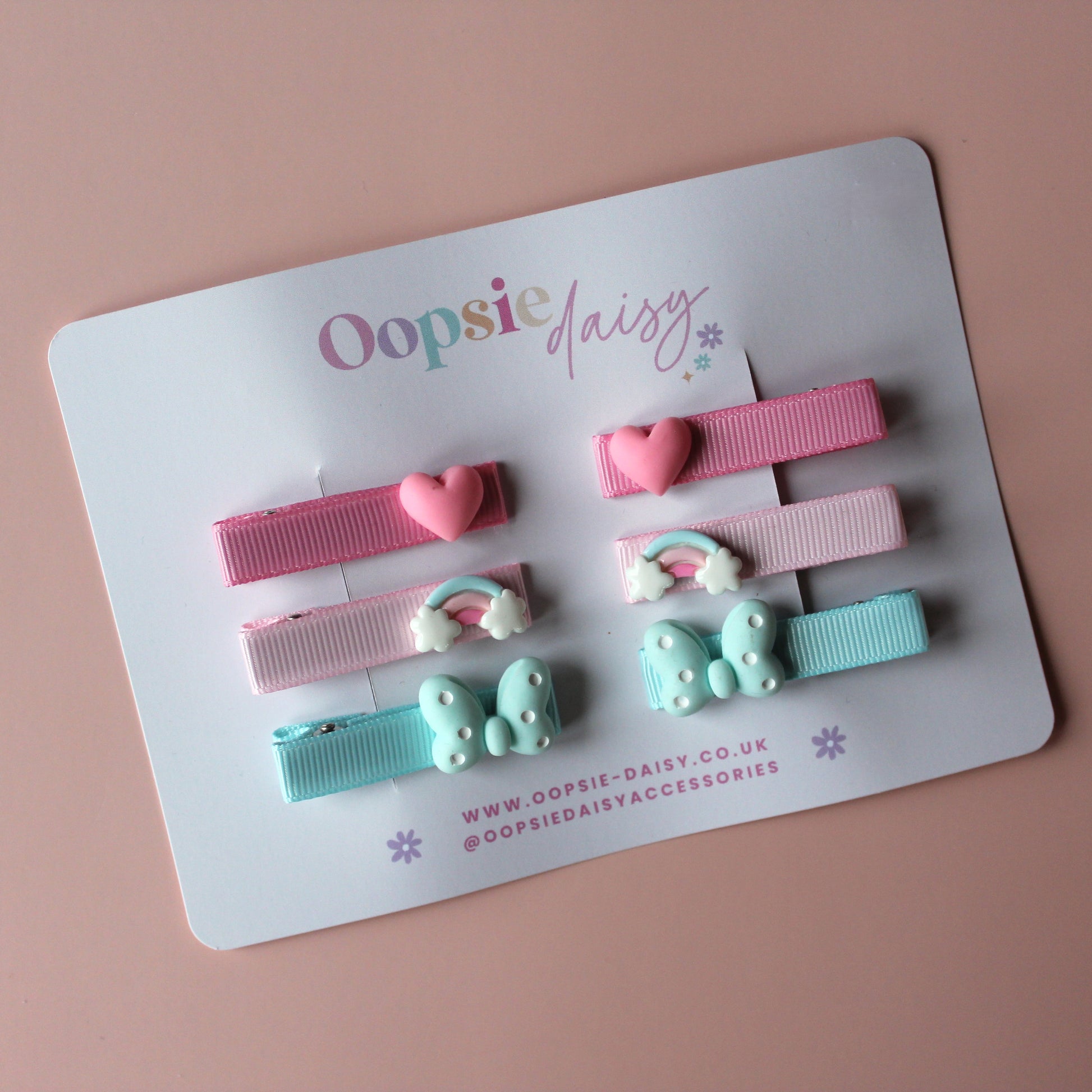 Set of colourful hair sliders with heart, rainbow and butterfly embellishments