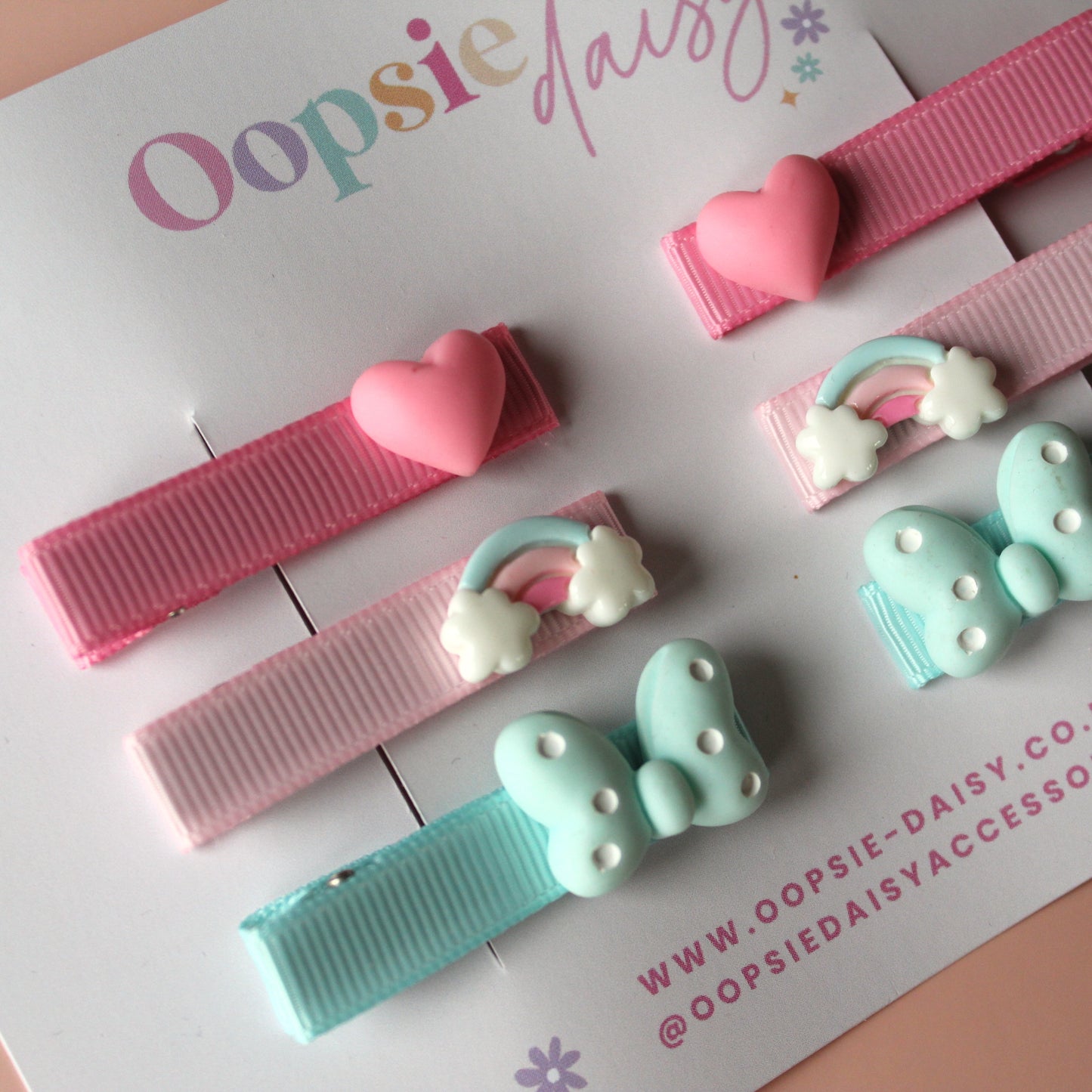 Set of colourful hair sliders with heart, rainbow and butterfly embellishments