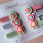 Pastel hair sliders with flower embellishments in purple, peachy-pink and green
