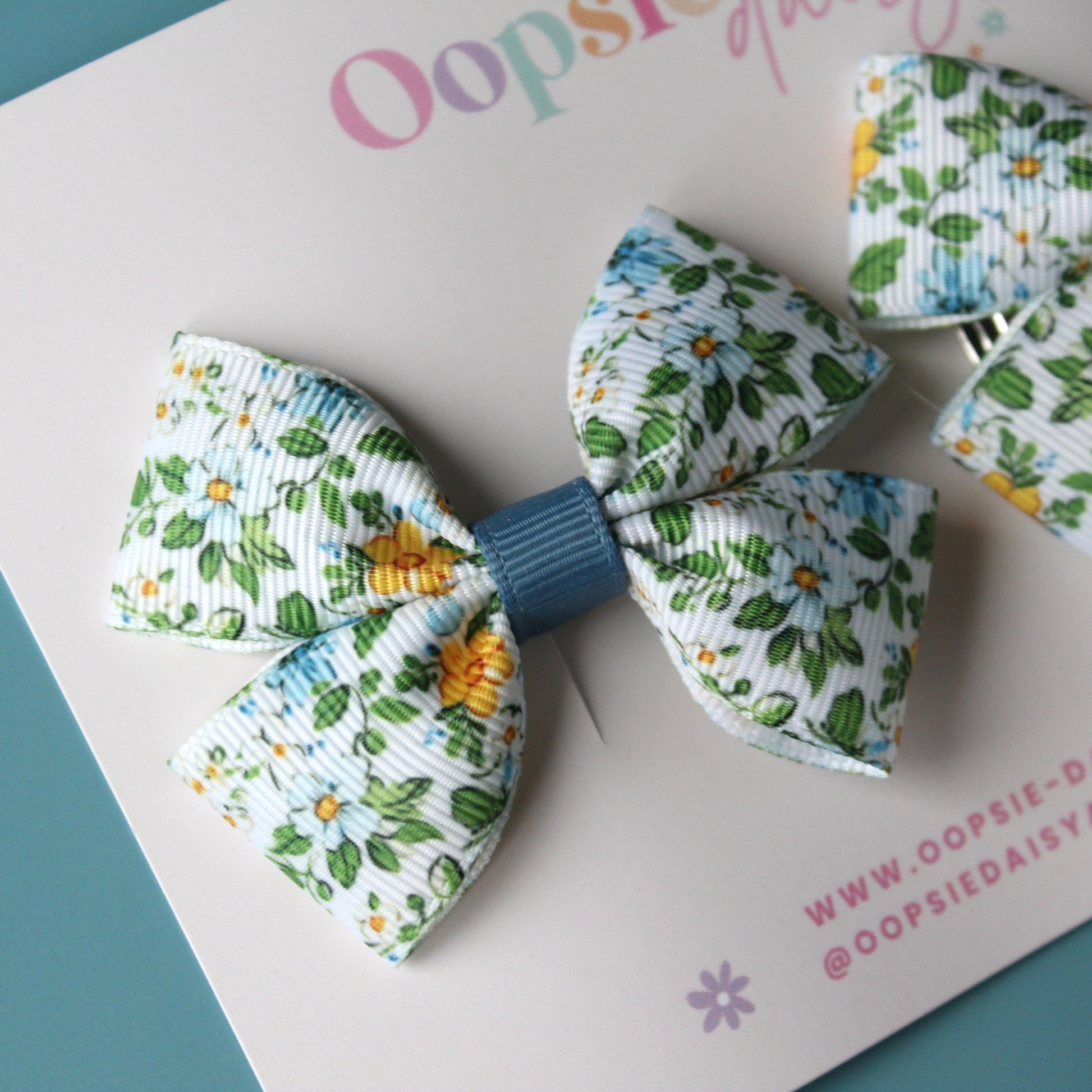 Ditsy blue floral pigtail bow clips