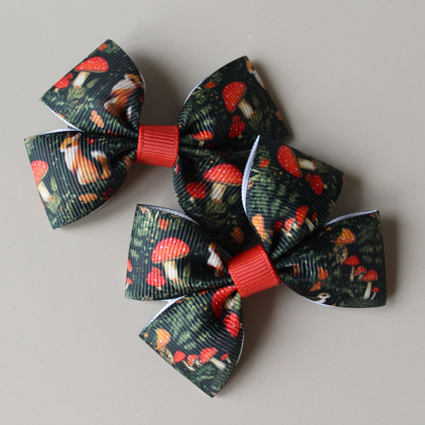 Autumnal woodland patterned hair bows with squirrels and mushrooms