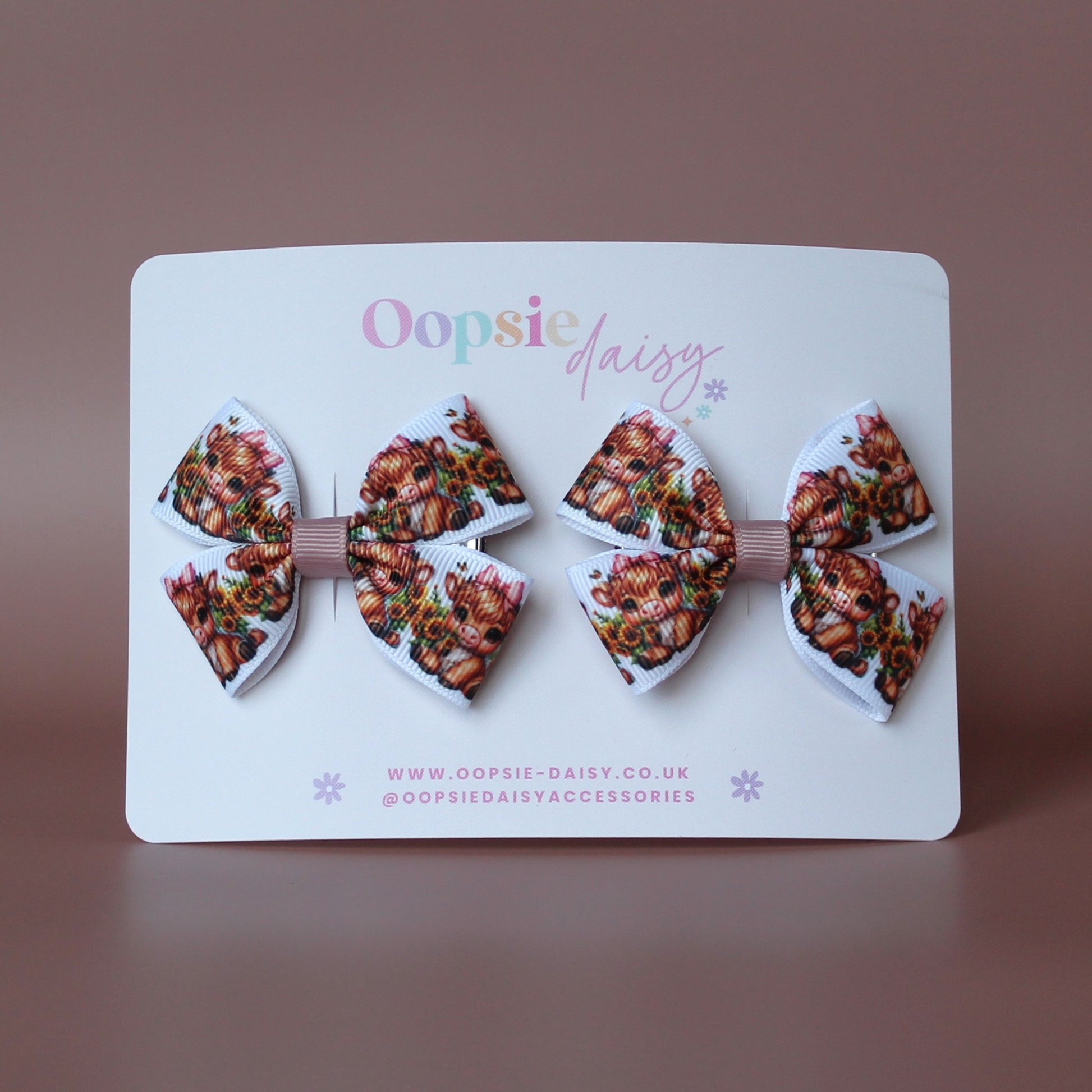 Two hair bows with cute baby cow pattern