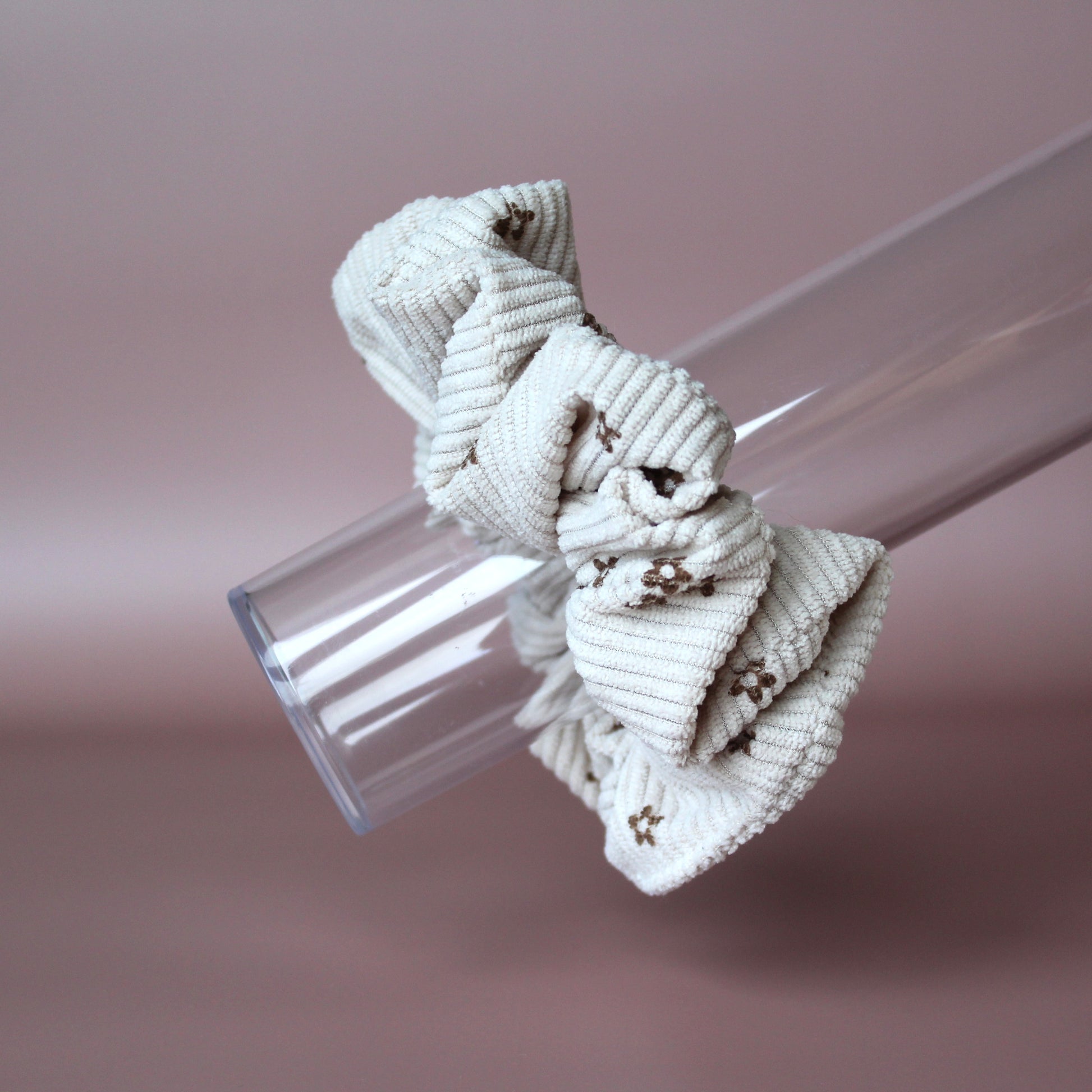 Oversized scrunchie in beige corded fabric with small brown flowers