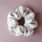 Oversized scrunchie in beige corded fabric with small brown flowers