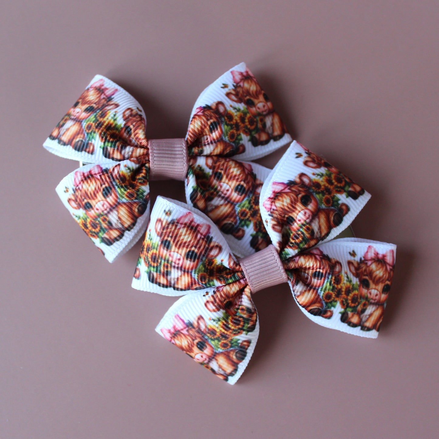 Two hair bows with cute baby cow pattern
