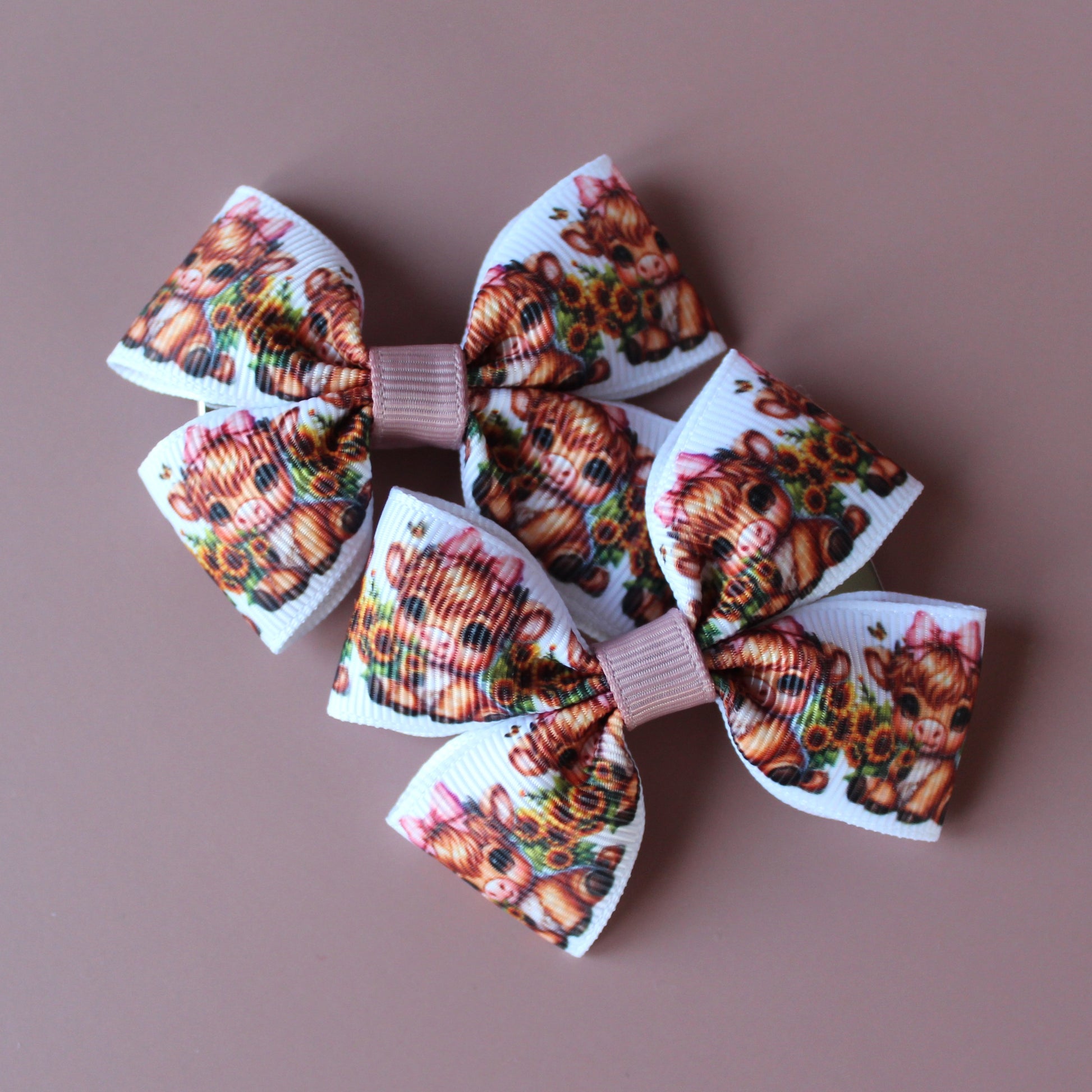 Two hair bows with cute baby cow pattern