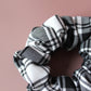 Black and white monochrome tartan scrunchie