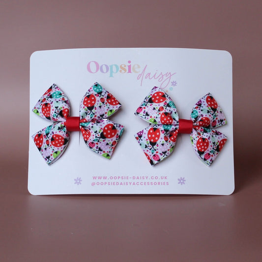 Hair bows with red and teal ladybird and polka dot pattern