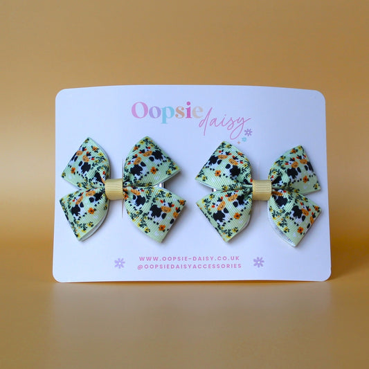 Green hair bows with cows and floral pattern