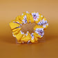 Yellow scrunchie with daisy flower pattern