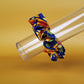 Oversized blue scrunchie with bold yellow and orange sunflowers