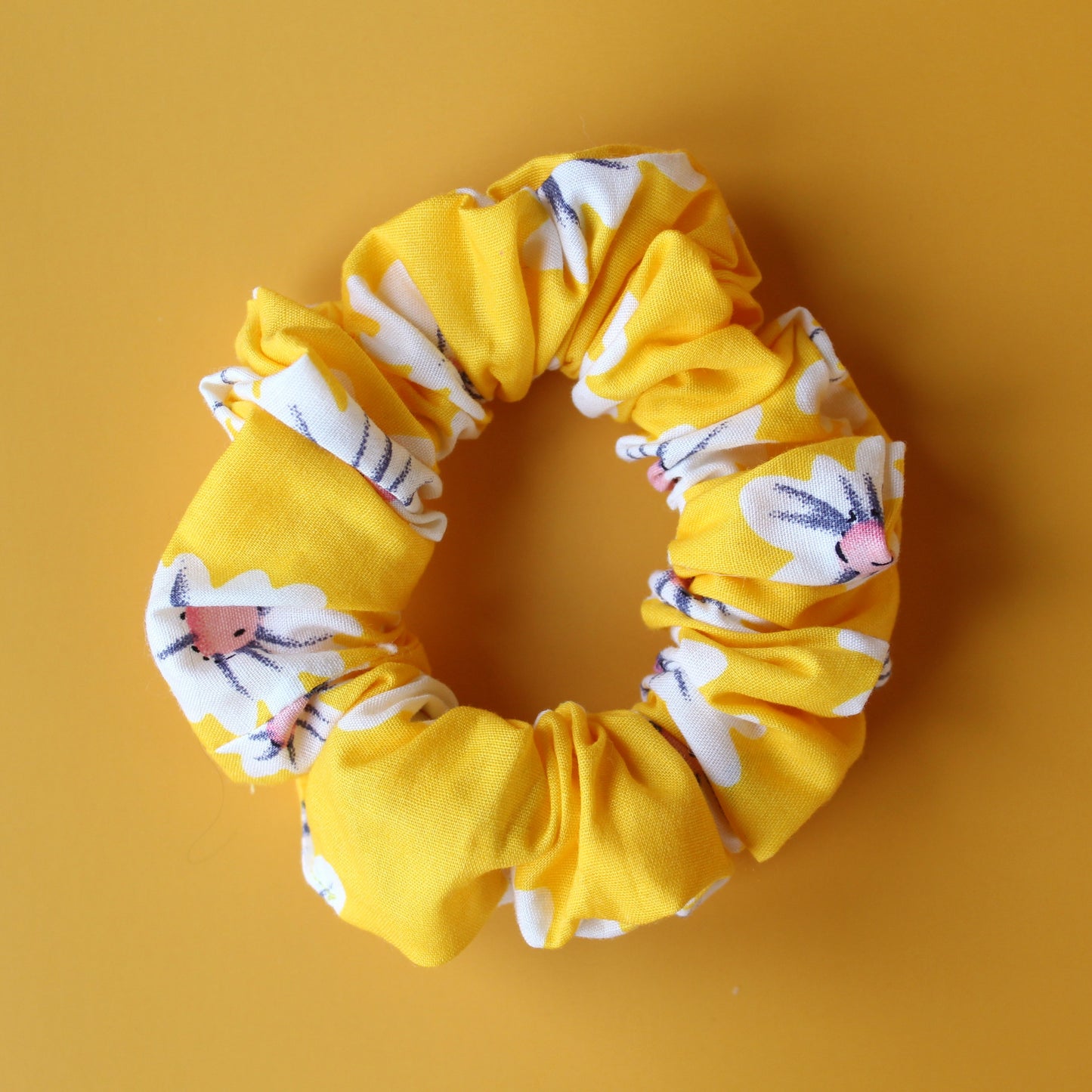 Yellow scrunchie with daisy flower pattern
