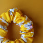 Yellow scrunchie with daisy flower pattern