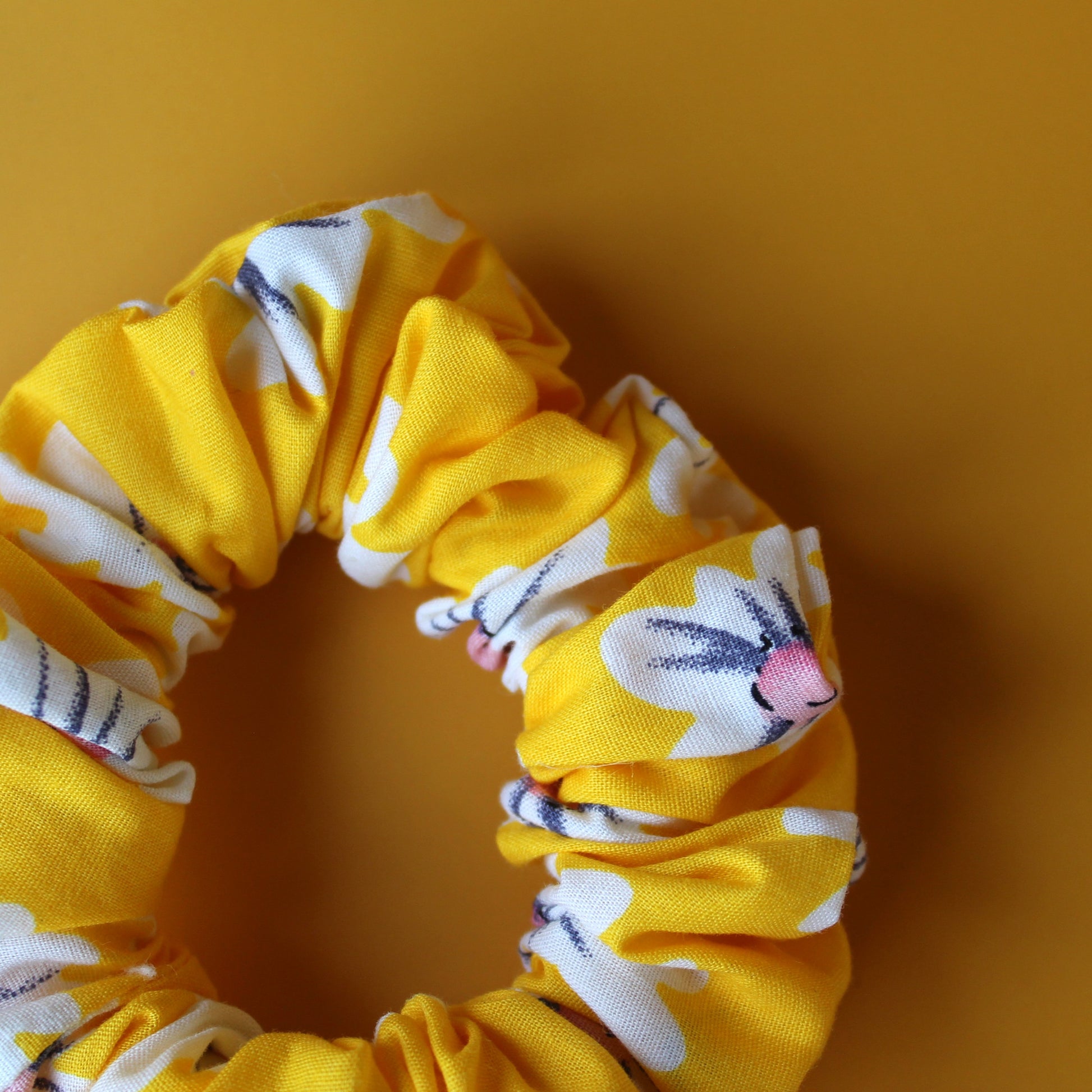 Yellow scrunchie with daisy flower pattern