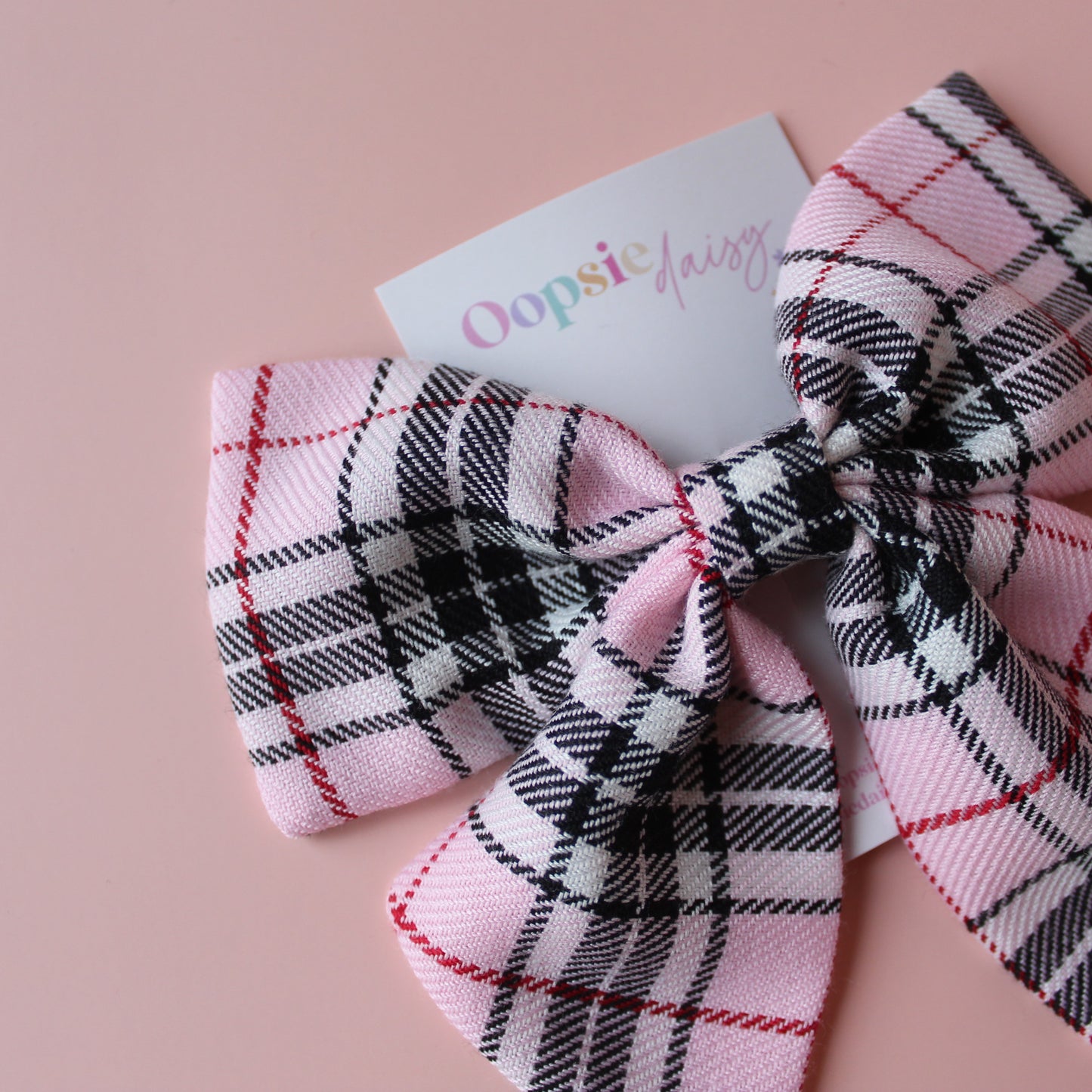 Plaid tartan hair bow in black and pink
