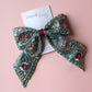 Teal hair bow with gold, pink and burgundy embroidered floral pattern with gold sequins