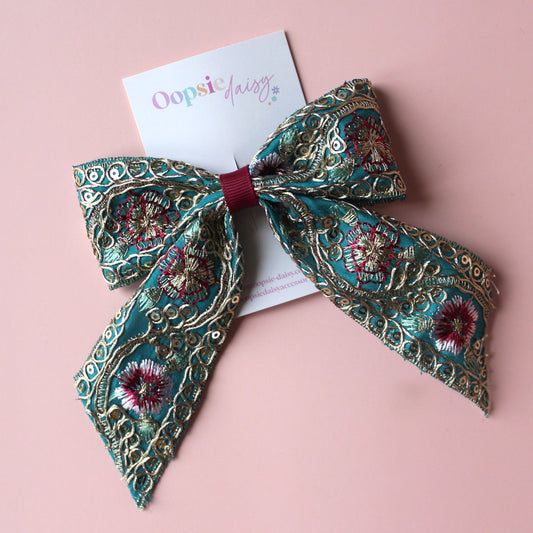 Teal hair bow with gold, pink and burgundy embroidered floral pattern with gold sequins