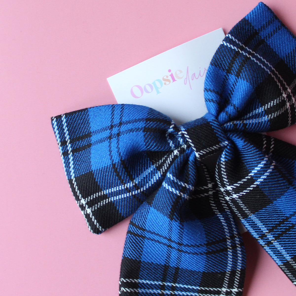 Blue and black plaid tartan bow