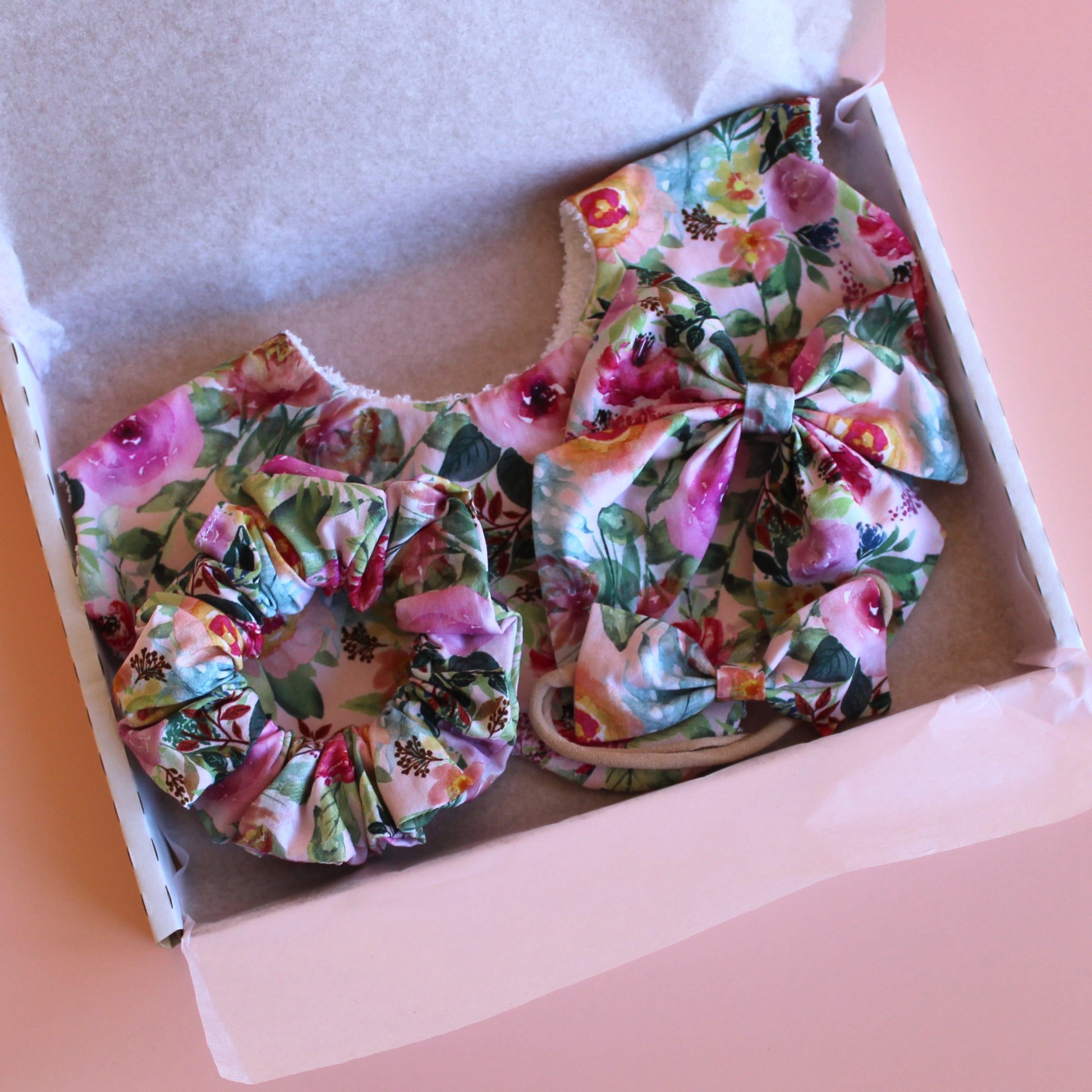Pink and multicolour floral mum, baby and sister matching accessory set with scallop bib, scrunchie, hair bow and headband