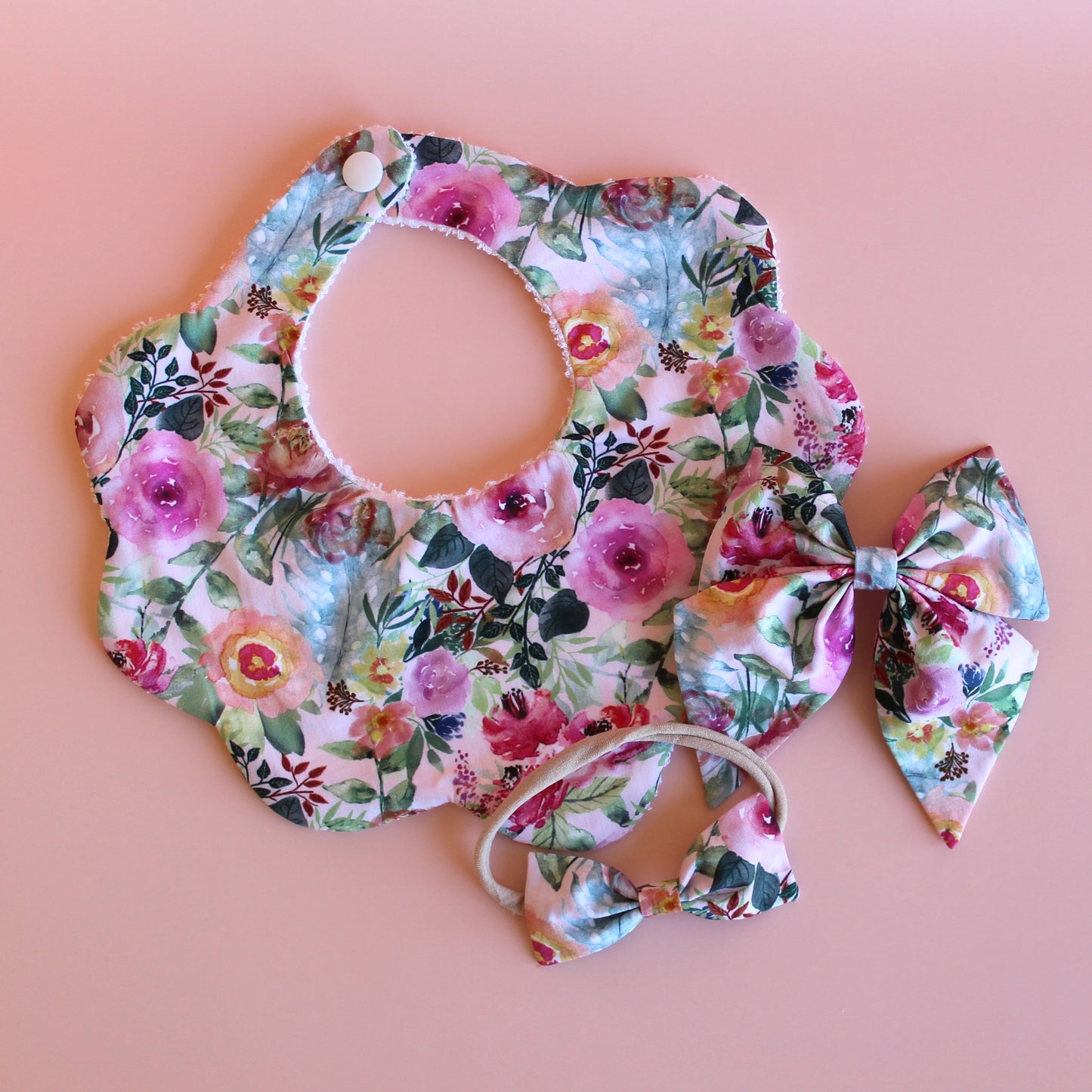 Pink and multicolour floral mum, baby and sister matching accessory set with scallop bib, hair bow and baby headband