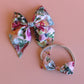 Pink and multicolour floral mum, baby and sister matching accessory set with hair bow and baby headband
