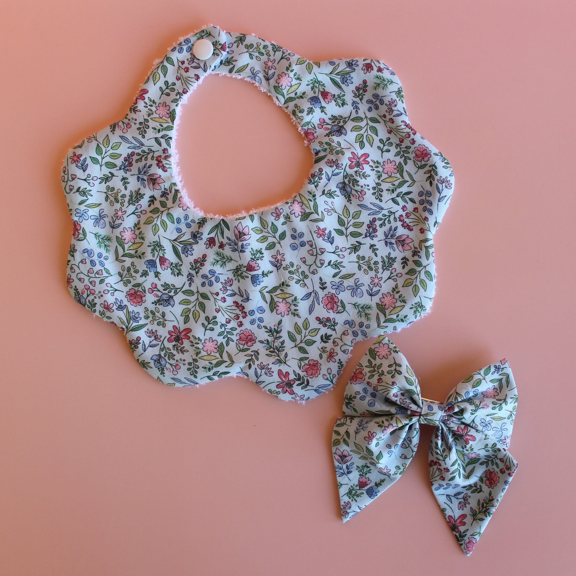 Blue floral gift set with  bow and scallop bib