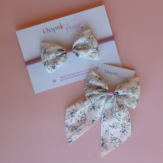 Cream hair bow gift set with little muted mauve-purple flowers