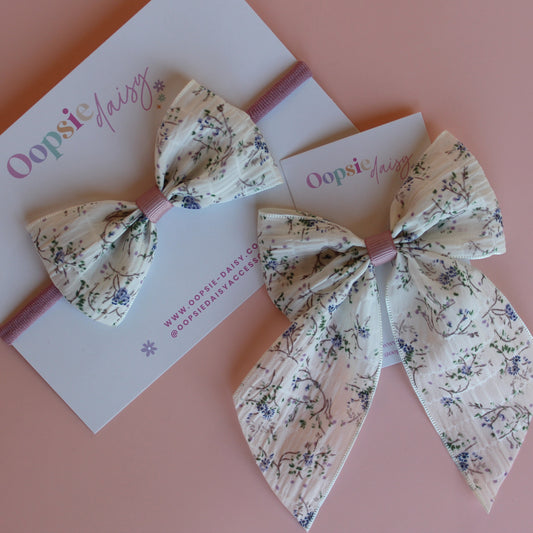 Cream hair bow gift set with little muted mauve-purple flowers